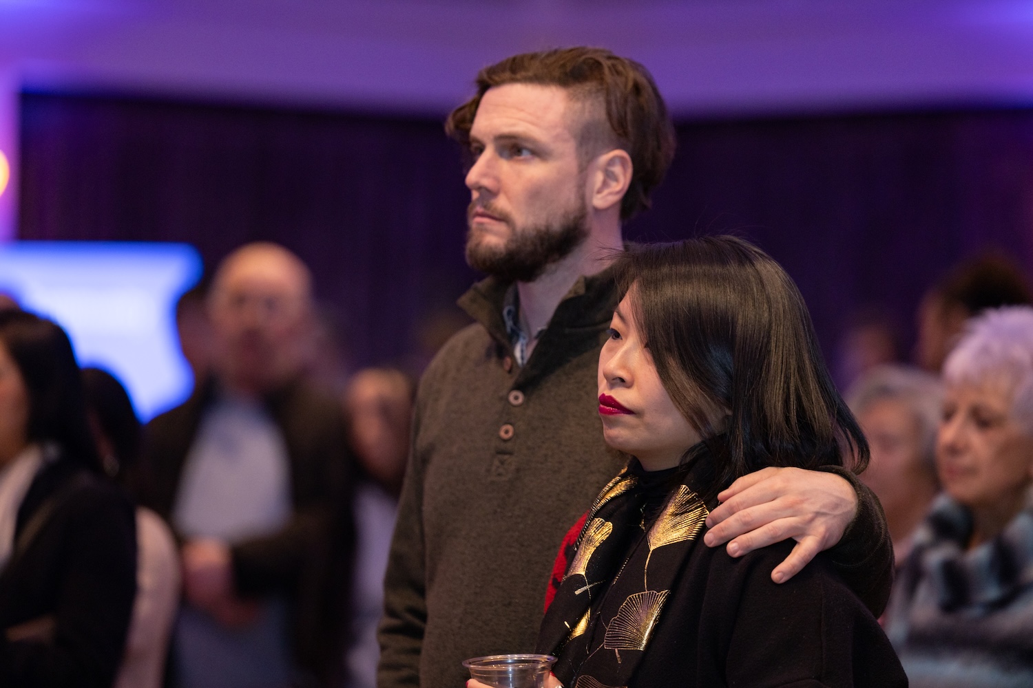 Sophia Ma and her partner listen to VBP Founder Tracey Nguyen Mang at the Our Journeys opening event