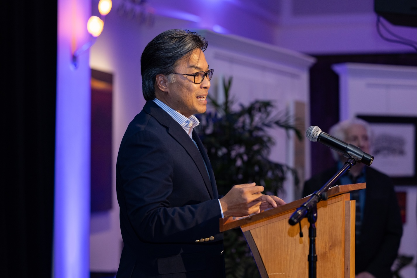 Ahn Parisi, board member of VBP, speaks at the Our Journeys opening event