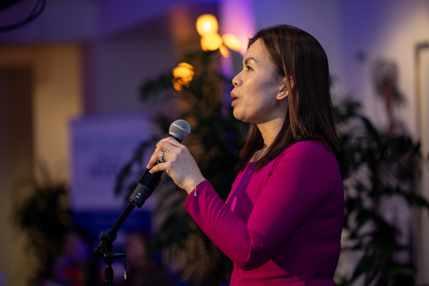 Local singer Panda performs a song at the Our Journeys opening event