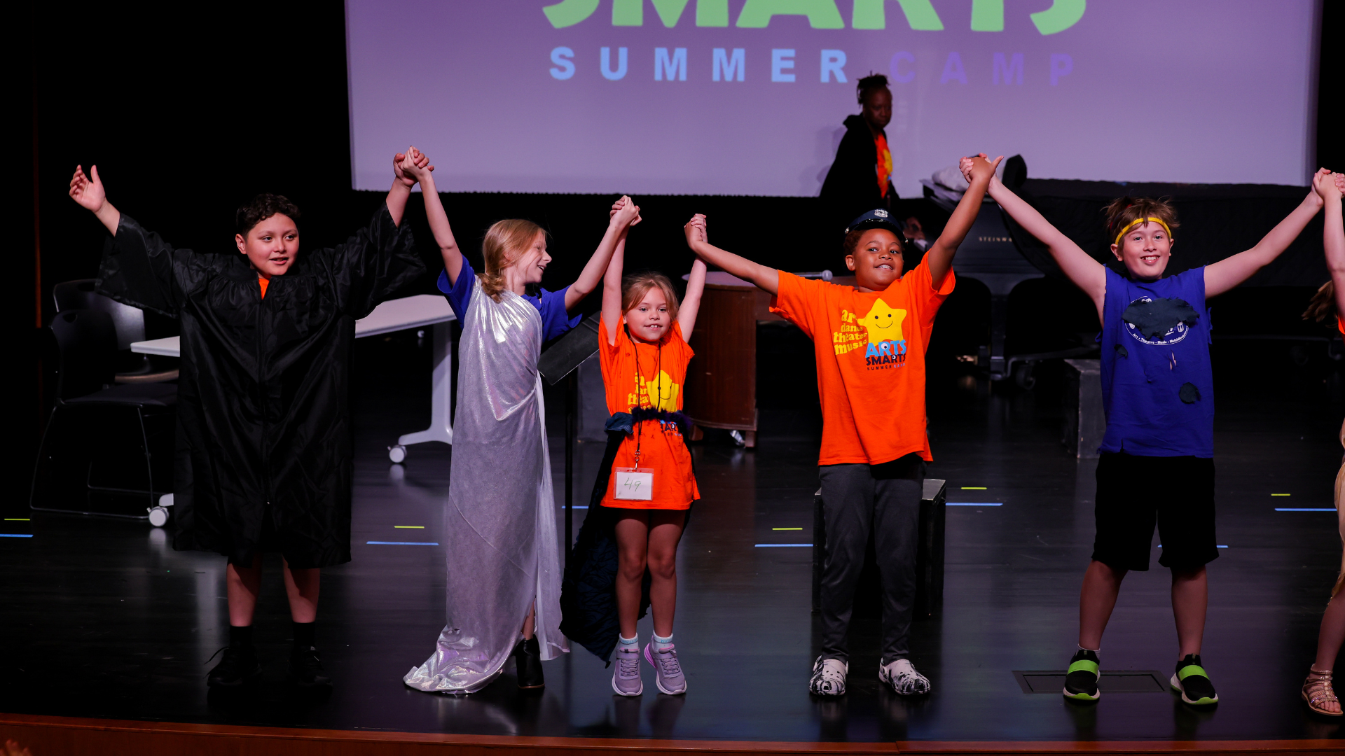 Arts Smarts campers take a bow after their final performance