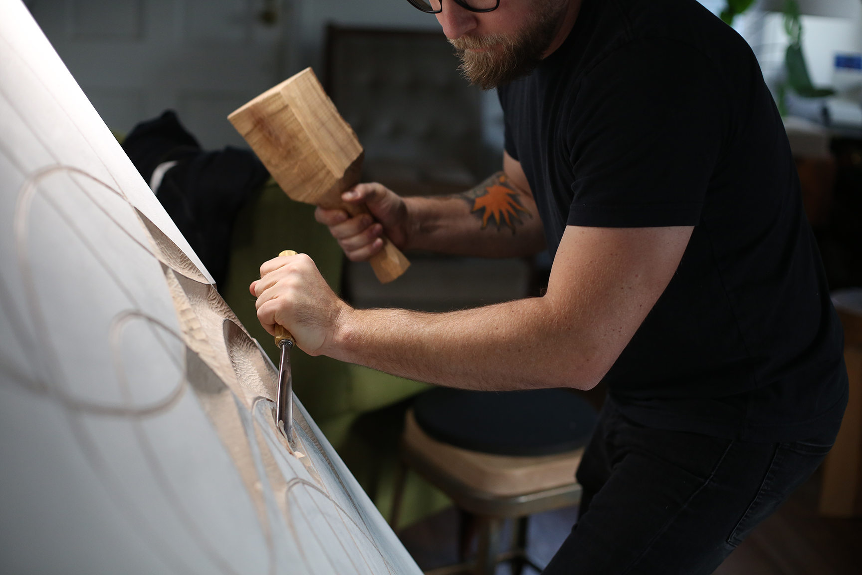 Rob Homan carves a sculpture by hand