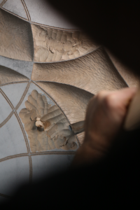 Rob Homan carves a sculpture by hand